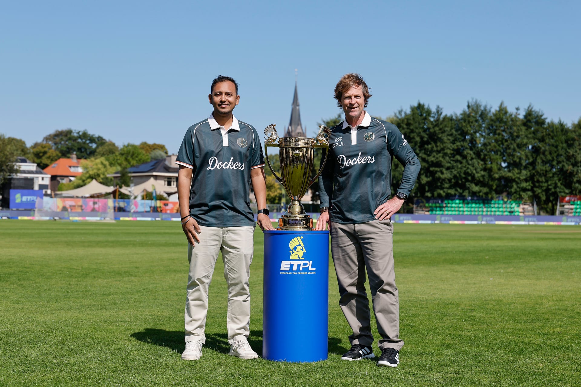 Rotterdam Dockers' Jonty Rhodes (R) poses alongside the ETPL trophy and Madhukar Shree, managing partner of the Dockers